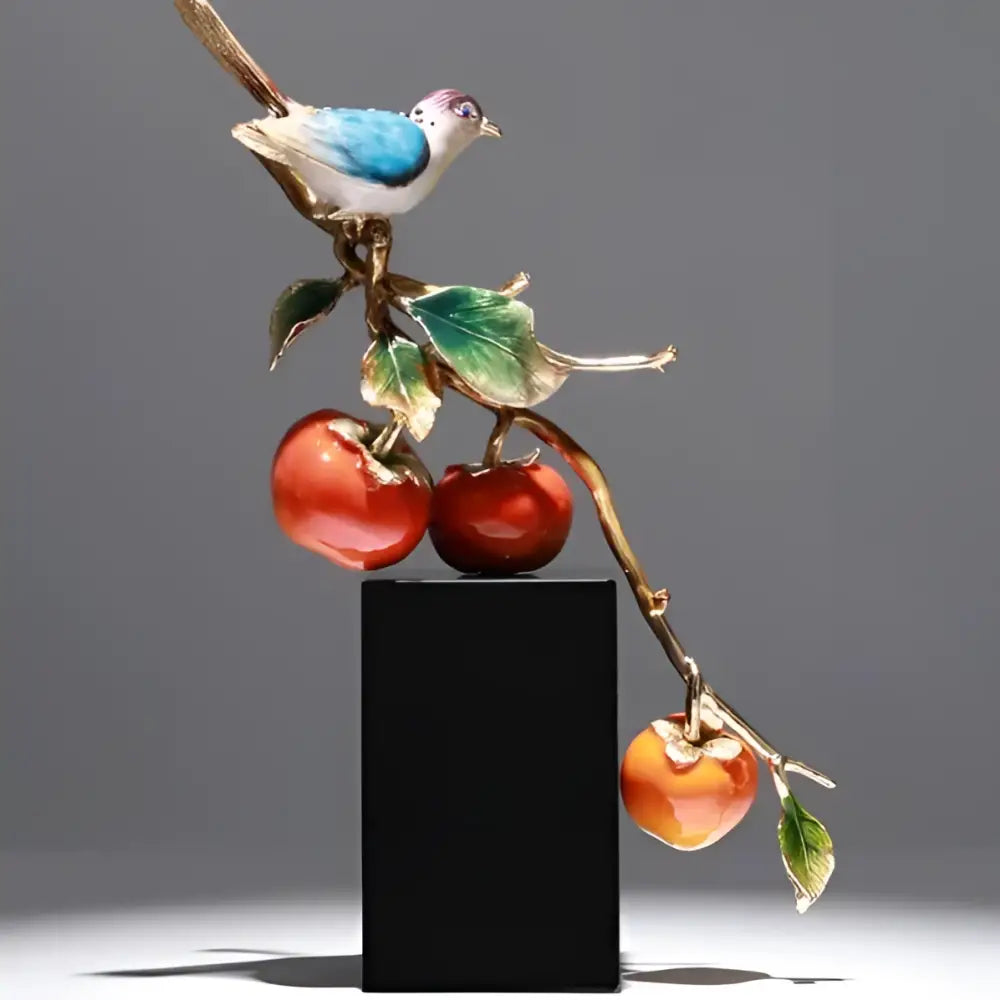 Decorbites™ enamel persimmon ruyi ornament featuring a porcelain bird with blue green and gold enamel detailing