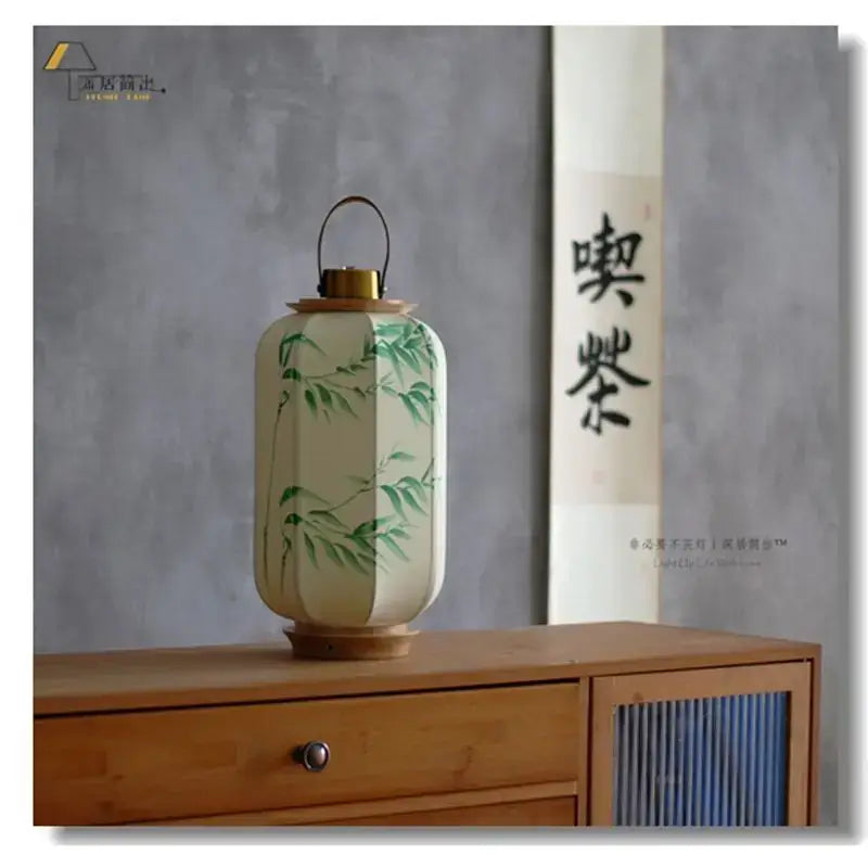 Decorbites chinese fabric desk lamp with cream paper lantern, green bamboo pattern, wooden base, and handle for antique style lighting