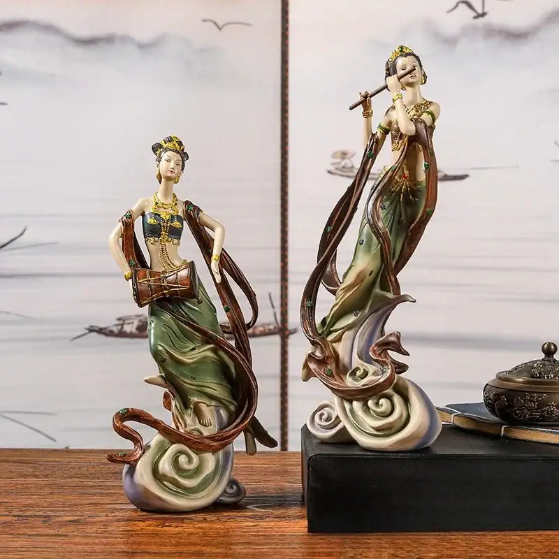 Two porcelain chinese goddess fairy figurines with gold accents in green robes playing musical instruments for home decor