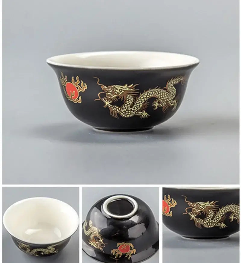 Black ceramic dragon tea cup with gold dragon and red cloud motifs and white interior by DecorBites porcelain mug set