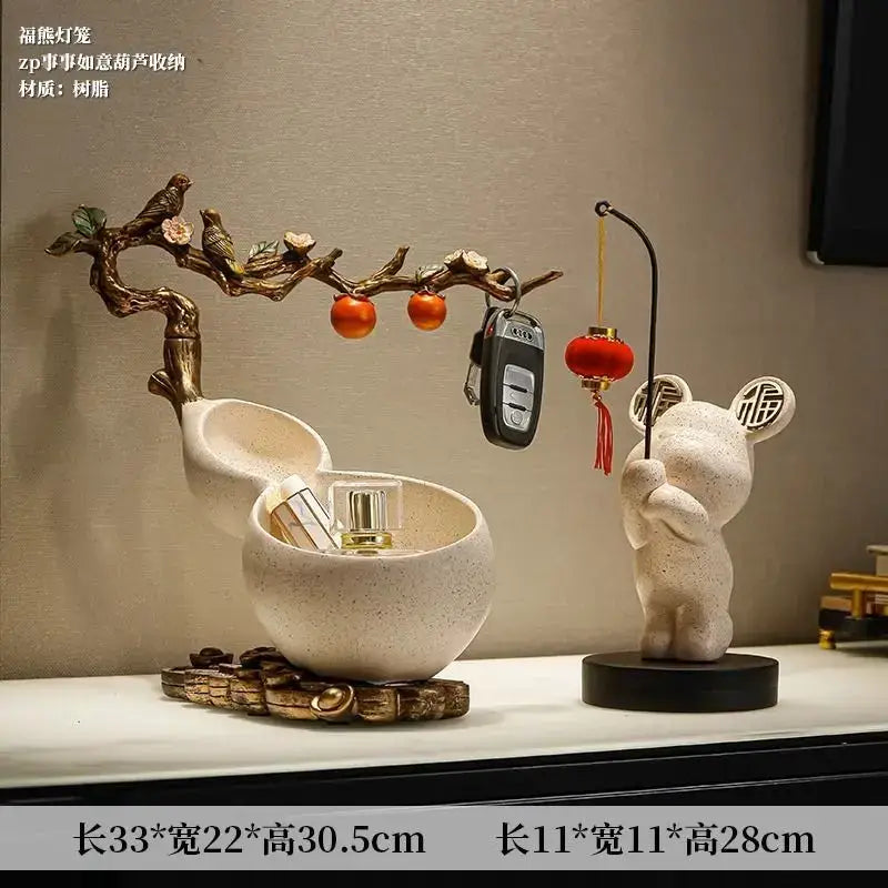 Cream-colored ceramic DecorBites™ Chinese gourd desktop storage decoration with open lid and tree design holding oranges and keys