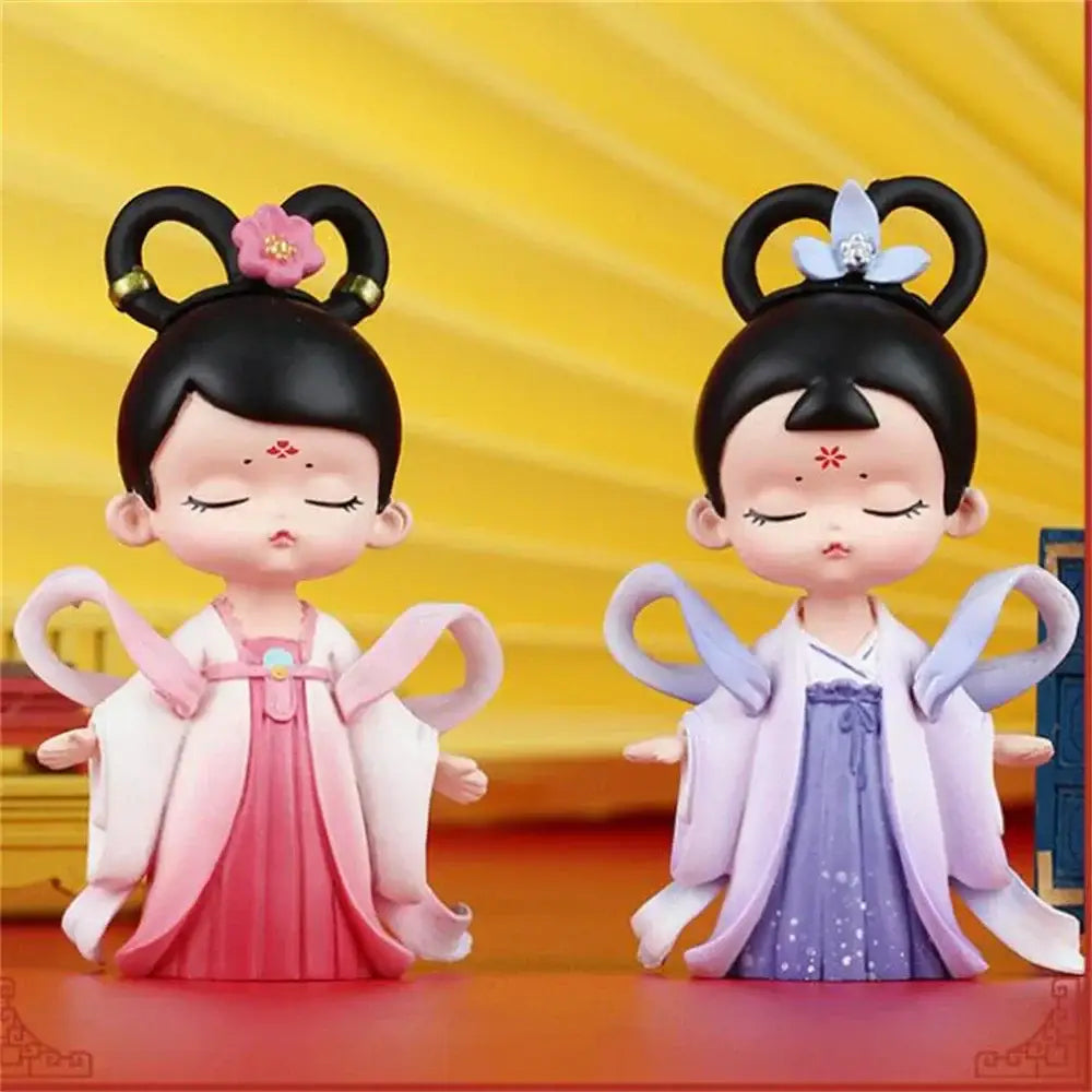 Two stylized resin hanfu court princess figurines in pink white and lavender for bookshelf decor by decorbites