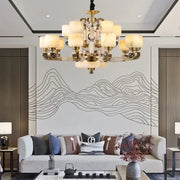 Gold-toned decorbites jade chandelier with multiple frosted glass shades for modern living room and restaurant décor