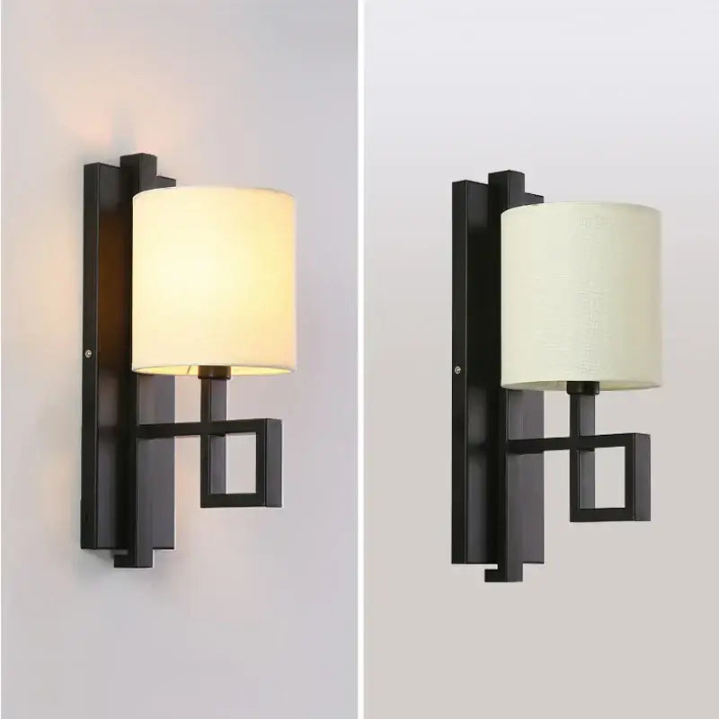 Modern black metal wall sconce with cylindrical off-white fabric shade lantern cloth wall light for bedroom and corridor