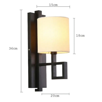 Decorbites™ black metal lantern cloth wall sconce with off-white cylindrical fabric shade for bedroom or corridor lighting