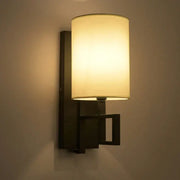 Decorbites™ warm-toned lantern cloth wall light with cylindrical lampshade and geometric dark metal sconce for bedroom and corridor