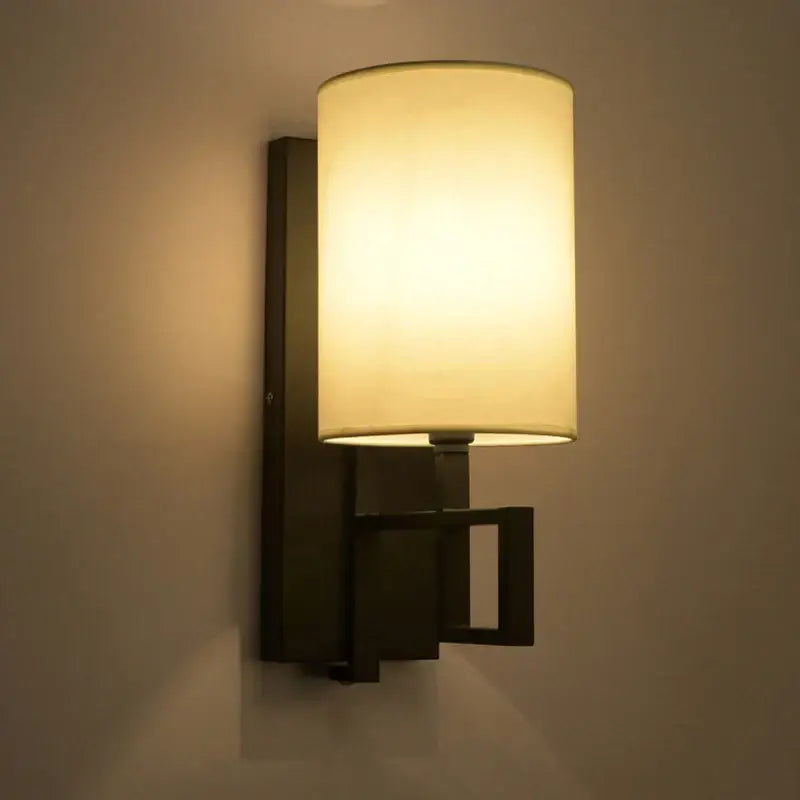 Decorbites™ warm-toned lantern cloth wall light with cylindrical lampshade and geometric dark metal sconce for bedroom and corridor