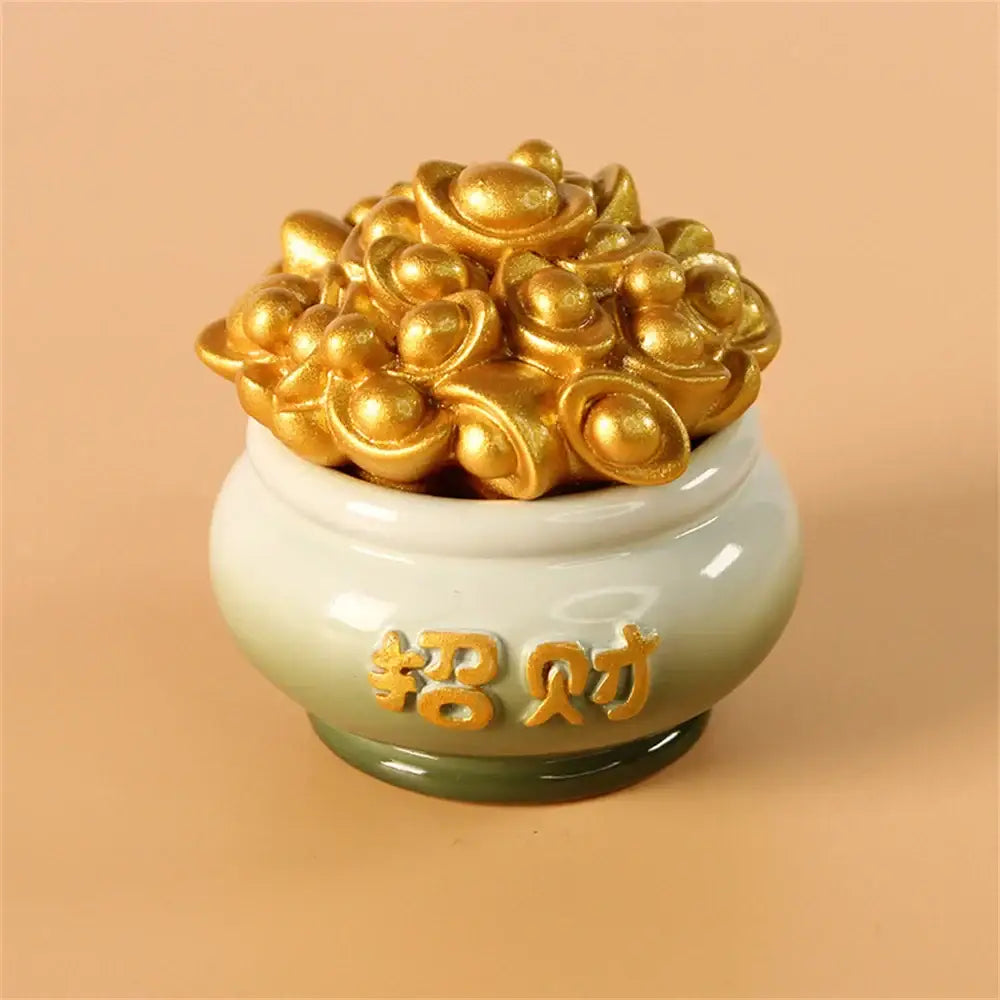 A ceramic pot with gradient green glaze and gold chinese characters overflowing with golden ingots in mythology lion figurines collection