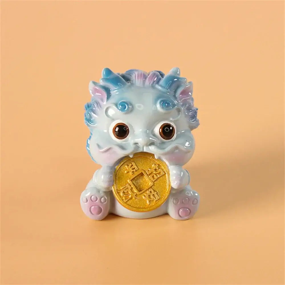 A light blue ceramic mythology lion figurine holding a golden coin from DecorBites™ for luck and wealth