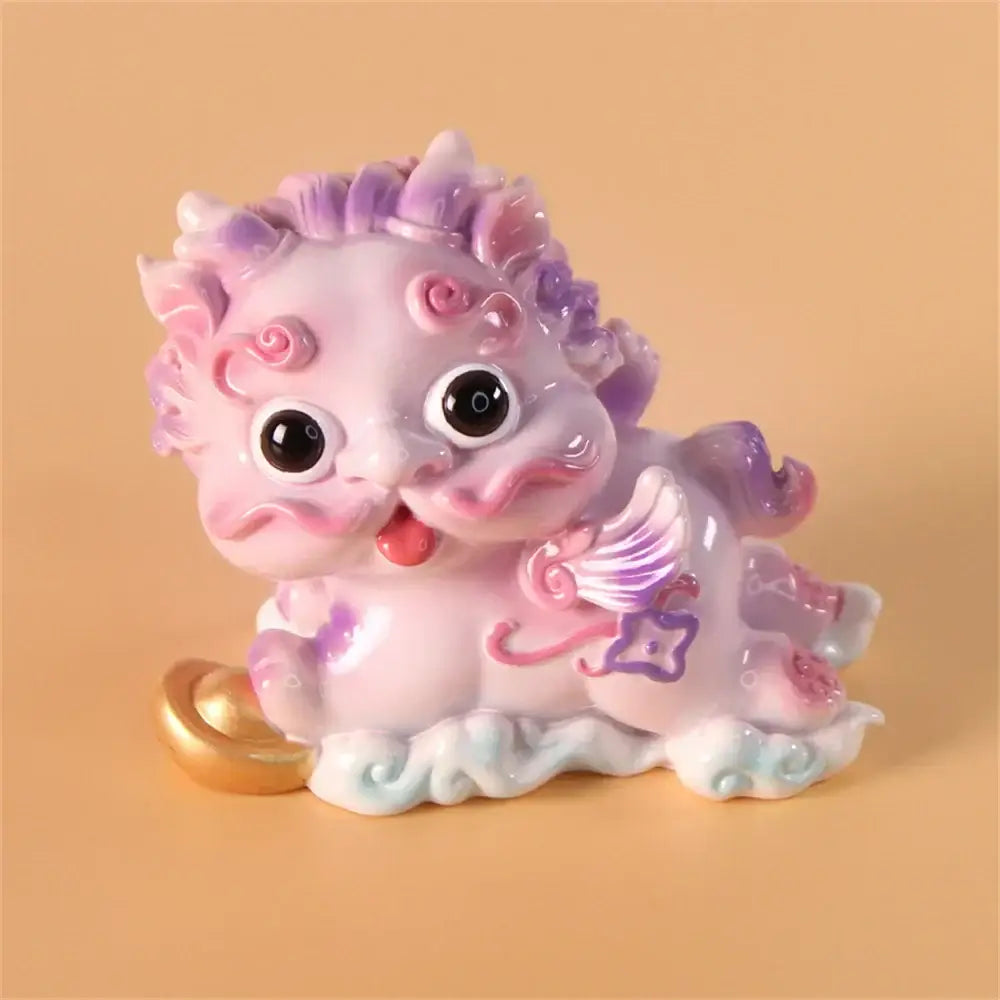 A pastel pink and purple ceramic mythology lion figurine with glossy black eyes and red tongue for luck and protection