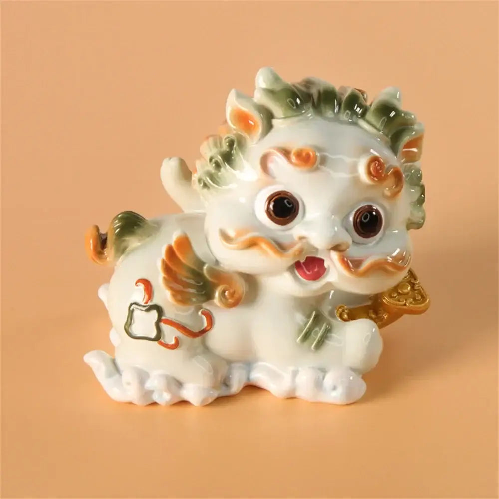 A white ceramic mythology lion figurine with green and orange accents from DecorBites™ for luck and protection