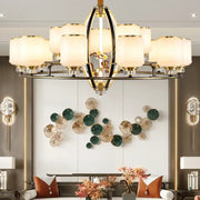 Gold-toned copper chandelier with frosted glass shades and crystal accents decorbites natural jade luxury villa lighting