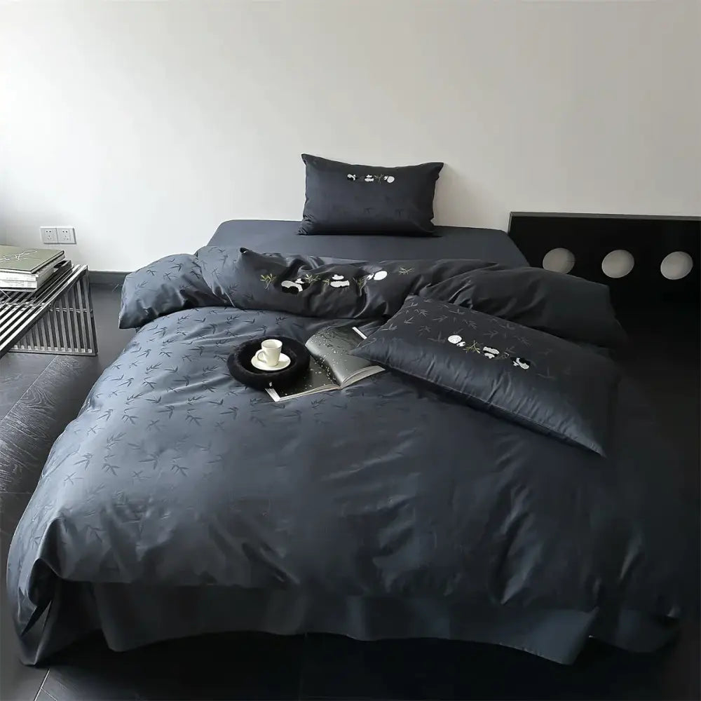 Dark gray satin-like bamboo jacquard duvet cover set with subtle bamboo leaf embroidery and matching pillow shams