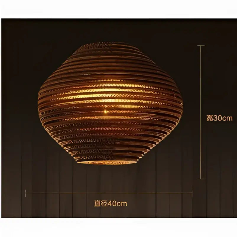 A warm-toned, oval handcrafted cardboard decorbites pendant light with ribbed texture for personalized home decor