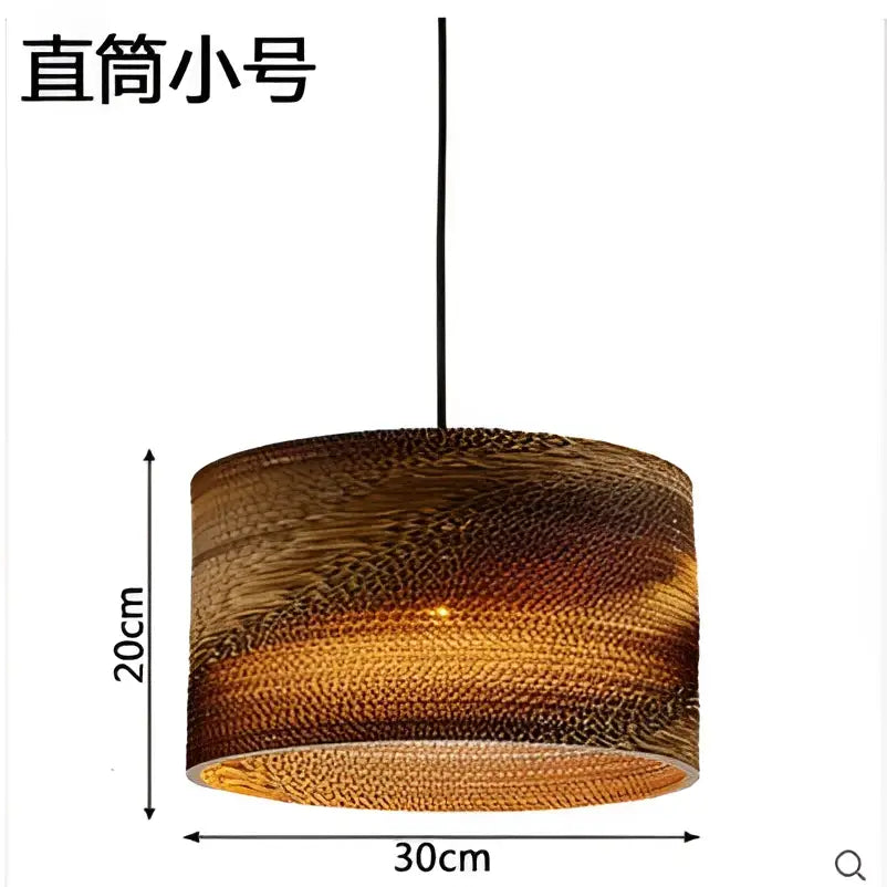 A cylindrical 20cm tall corrugated cardboard pendant light with warm amber glow from decorbites pendant lights