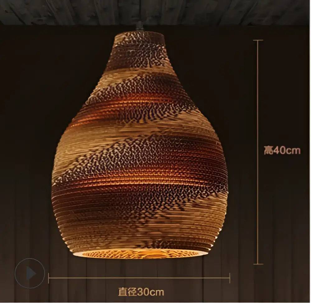 A warm-toned handcrafted DecorBites pendant light in woven corrugated cardboard with brown and orange stripes