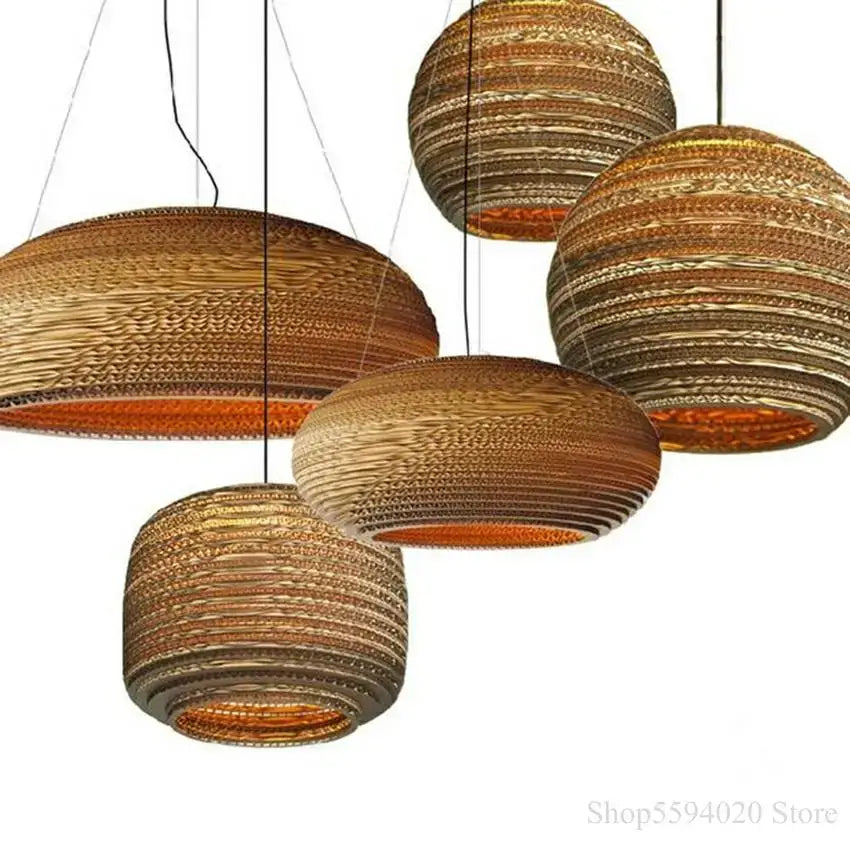 Golden ribbed paper pendant light with warm amber glow for southeast asian style restaurant and living room decorbites
