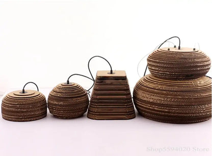 Set of four brown corrugated cardboard paper pendant lights with tiered design and black cords for southeast asian style decor