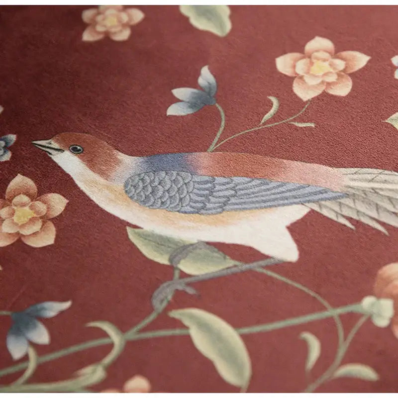 Embroidered bird with brown head on vines against red fabric on decorbites chinese peony flower pillow cover