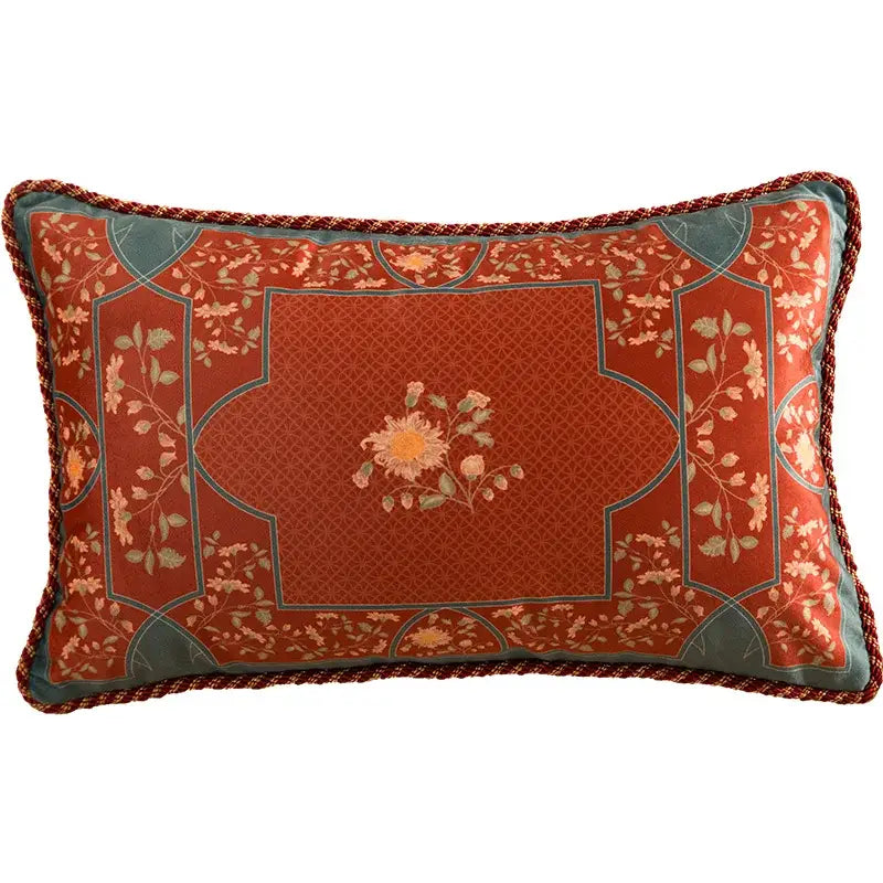 Rectangular pillow cover with rust fabric featuring decorbites chinese peony flower print and braided red trim