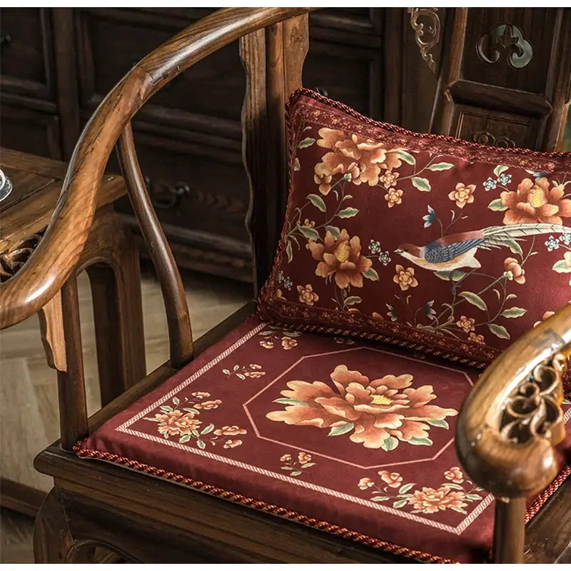 Rich burgundy velvet pillow cover with embroidered chinese peony flower and bird motifs by decorbites on wooden chair