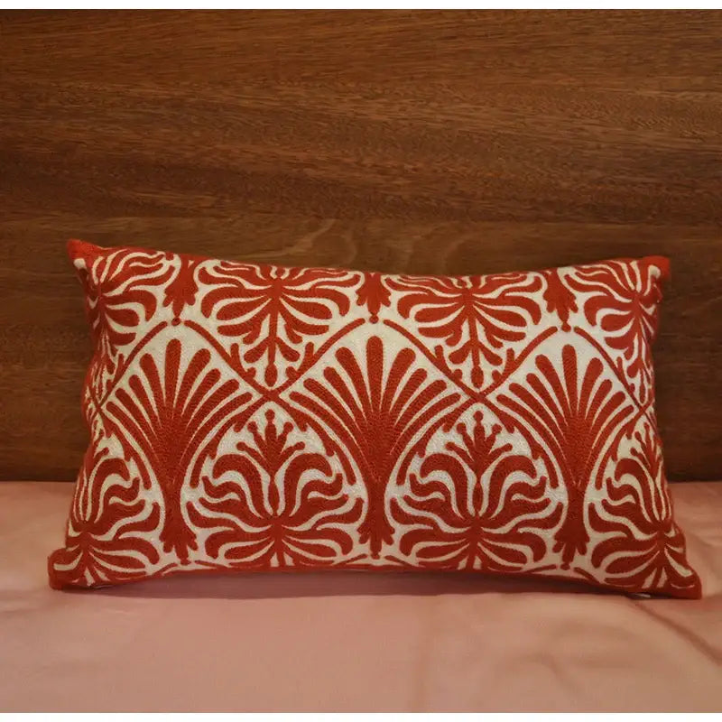 A rectangular cushion with a red and white embroidered damask pattern in the decorbites™ red satin cotton wedding duvet set