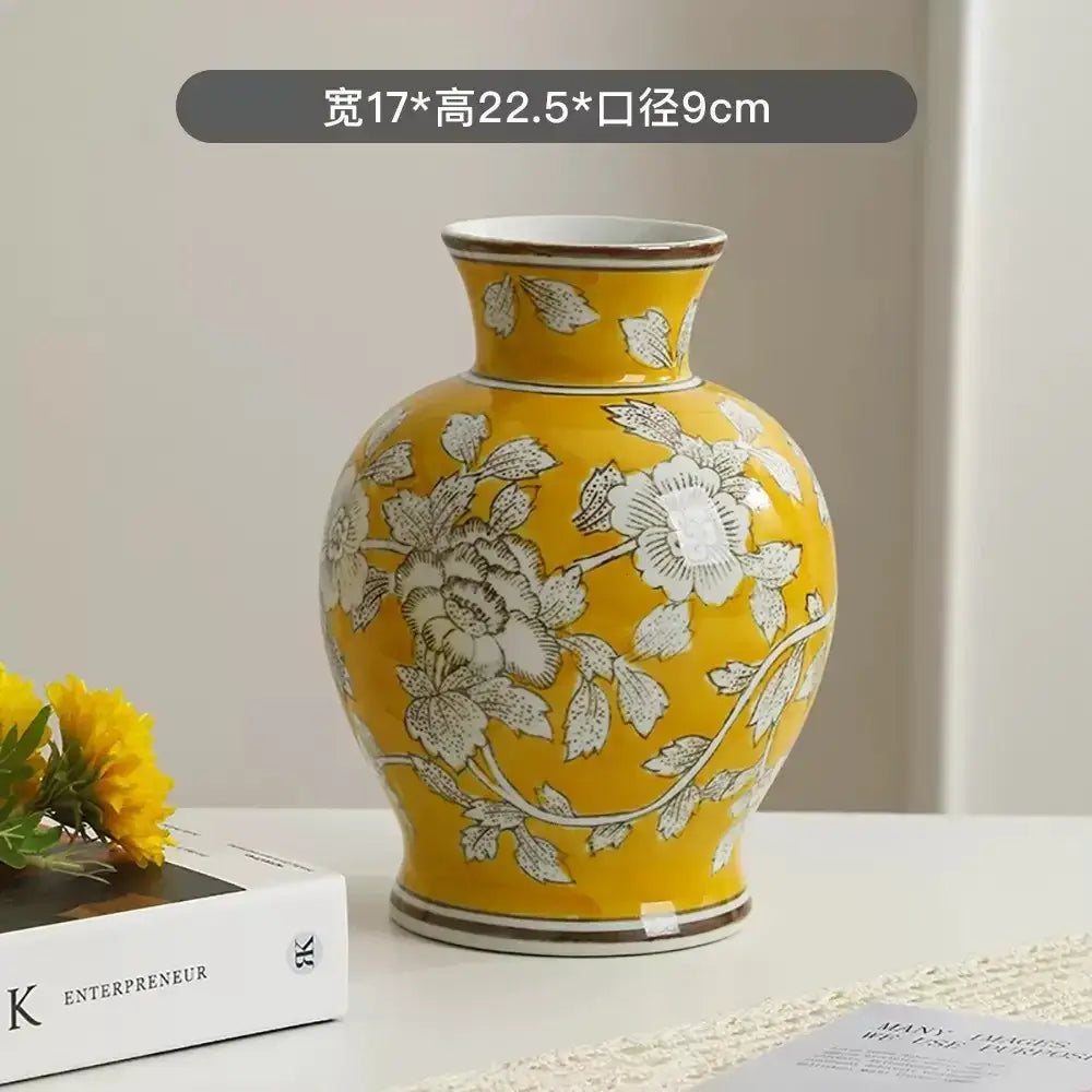 A vibrant yellow ceramic vase with intricate white floral patterns and brown accents in decorbites chinese retro style