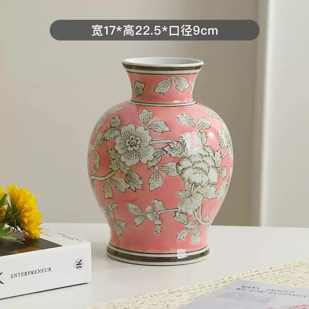 A pink ceramic DecorBites Chinese retro vase with silver floral patterns and gold-trimmed rim for home decor