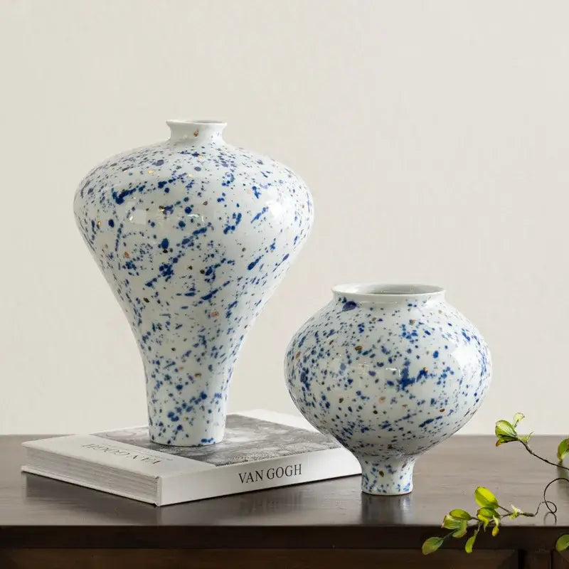 Two decorbites™ retro ceramic vases with white base and blue speckled glaze for handmade home decor flower arrangement