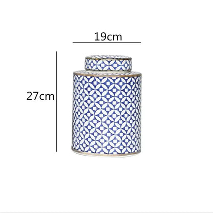 A tall porcelain tea canister with lid featuring blue and white geometric decorbites chinese retro ceramics design