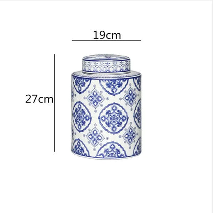 A tall cylindrical porcelain tea canister with blue and white floral patterns from decorbites chinese retro ceramics golden collection