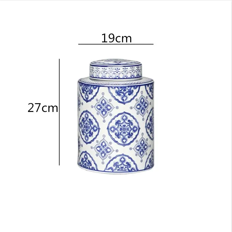 A tall cylindrical porcelain tea canister with blue and white floral patterns from decorbites chinese retro ceramics golden collection