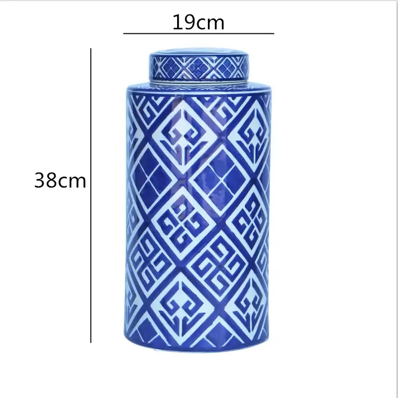 A tall cylindrical porcelain tea canister with lid in blue and white geometric pattern from decorbites chinese retro ceramics golden collection