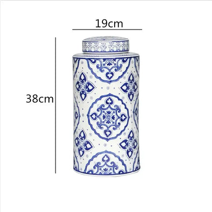 A tall cylindrical porcelain tea canister with intricate blue and white floral patterns from decorbites chinese retro ceramics golden collection