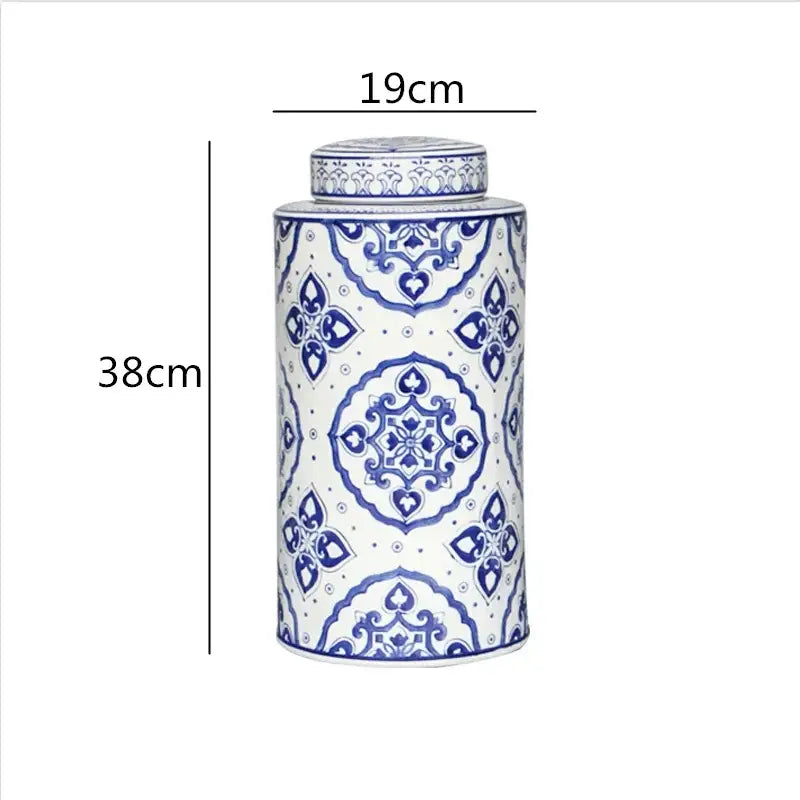 A tall cylindrical porcelain tea canister with intricate blue and white floral patterns from decorbites chinese retro ceramics golden collection