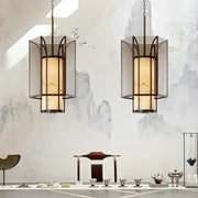 Two elegant black-framed lanterns with amber glass panels hang symmetrically in decorbites chinese retro chandelier