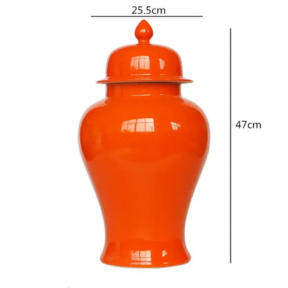 Vibrant orange ceramic general jar vase with matching lid and decorative finial for home decor and storage