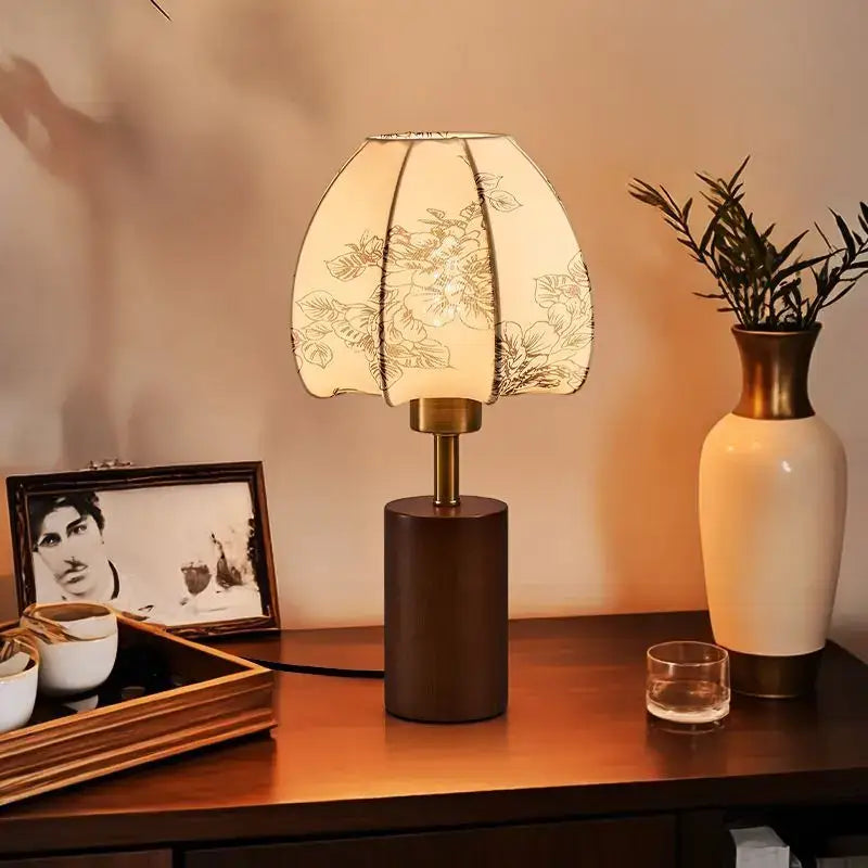 Warm-toned bedside lamp with pleated floral fabric shade and brass accents from DecorBites Chinese retro patterned collection