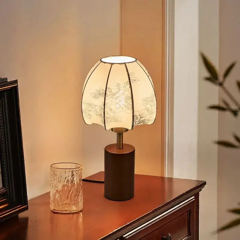 A decorbites chinese retro bedside lamp with cream pleated fabric shade and dark brown cylindrical base
