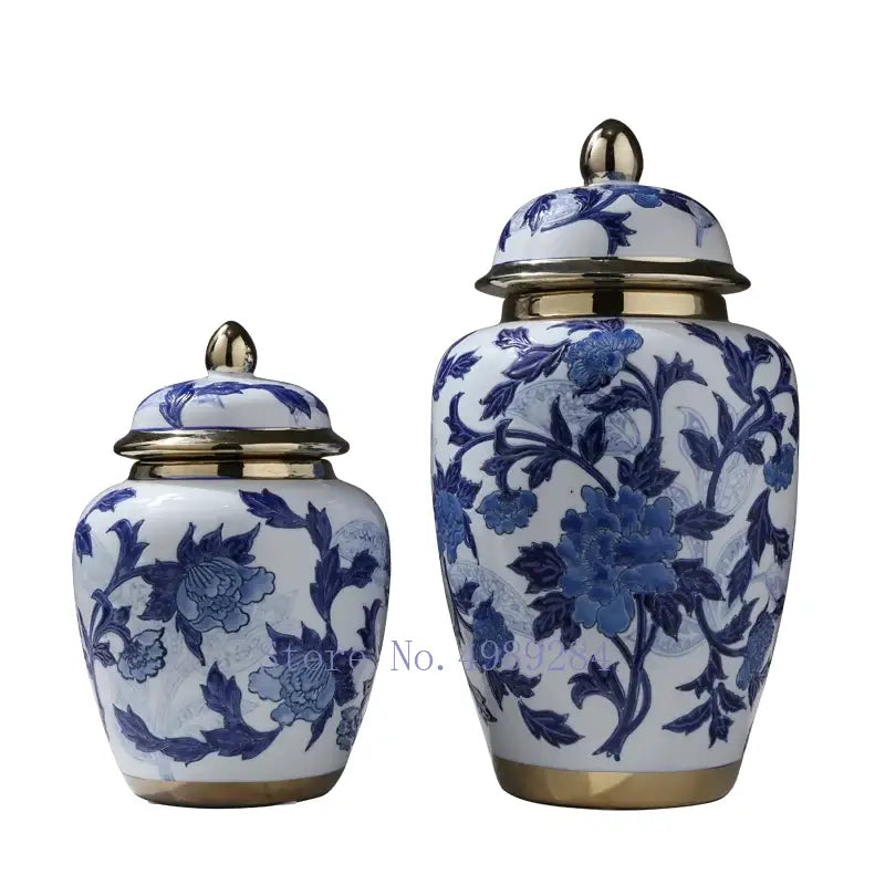 DecorBites™ Chinese retro blue and white porcelain storage tank vase with gold-trimmed lid and intricate floral patterns