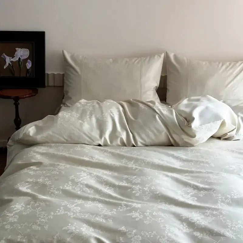 Cream-colored satin duvet cover set with delicate white floral embroidery from decorbites chinese style jacquard collection