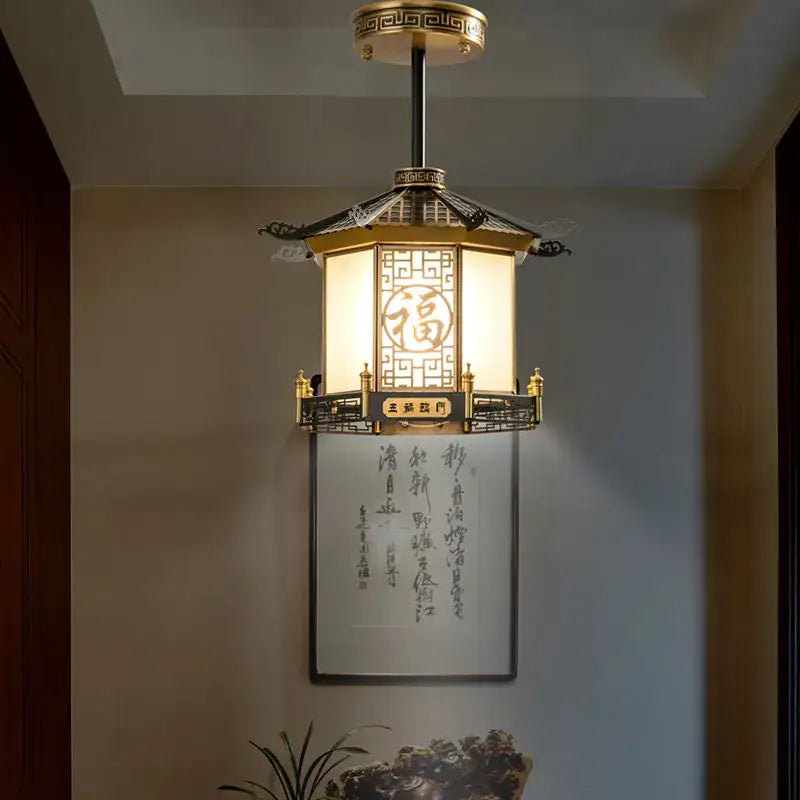 Golden pendant light from decorbites chinese style featuring glowing white panel with embossed fu character for balcony use