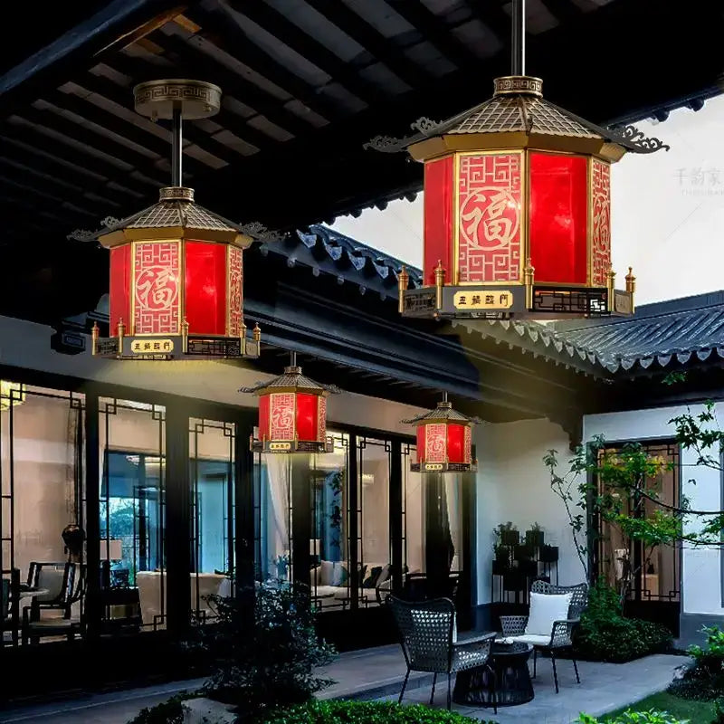 Red lantern pendant light with gold-trimmed pagoda frames and intricate chinese characters by decorbites chinese style for balcony use