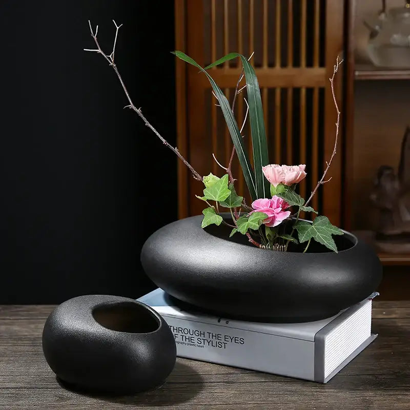 Black ceramic flowerpot vase with matte finish and smooth rounded contours for bonsai floral decor by DecorBites™