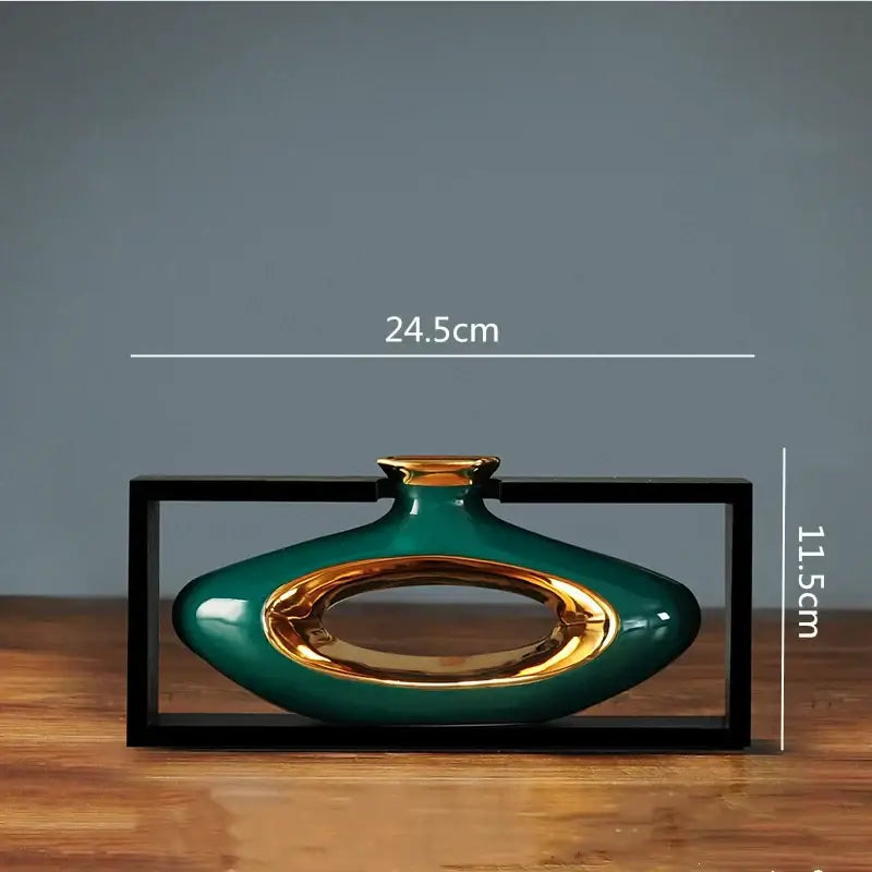 A sleek glossy teal ceramic vase with gold oval cutout and rim from decorbites chinese style collection
