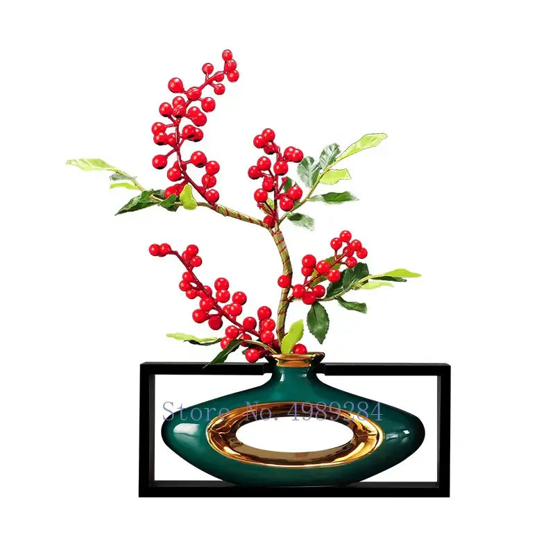 Emerald green ceramic vase with gold rim and handle holding artificial red berries in DecorBites Chinese style ceramic design