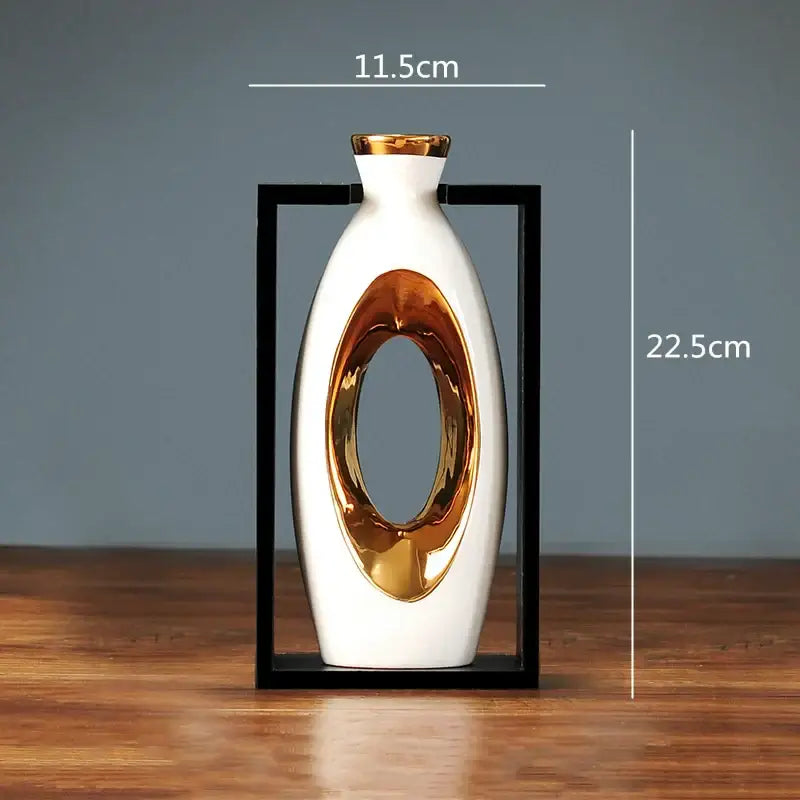 A sleek white ceramic vase with a glossy gold oval cutout and rim in a black frame decorbites chinese style ceramic vase