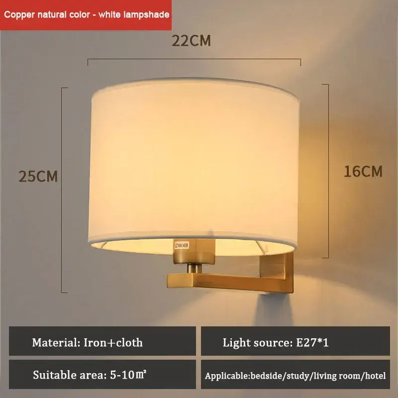 Copper-finished cloth covered wall lamp with cylindrical white fabric shade for bedroom and living room decor