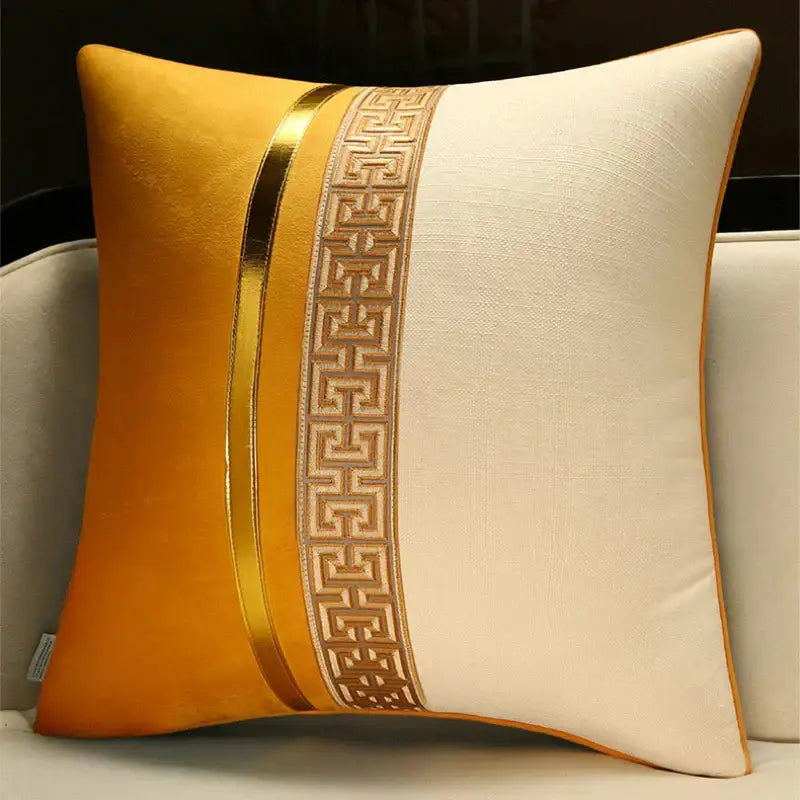 Golden and cream decorative pillow cover with metallic gold trim and intricate geometric pattern for home and sofa use