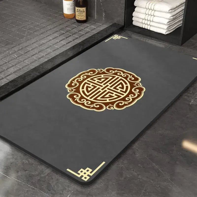 Black rubber DecorBites™ entry door mat with gold brown Chinese knot design super absorbent and anti slip